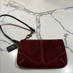 Coach Burgundy Suede Wristlet in good condition.
